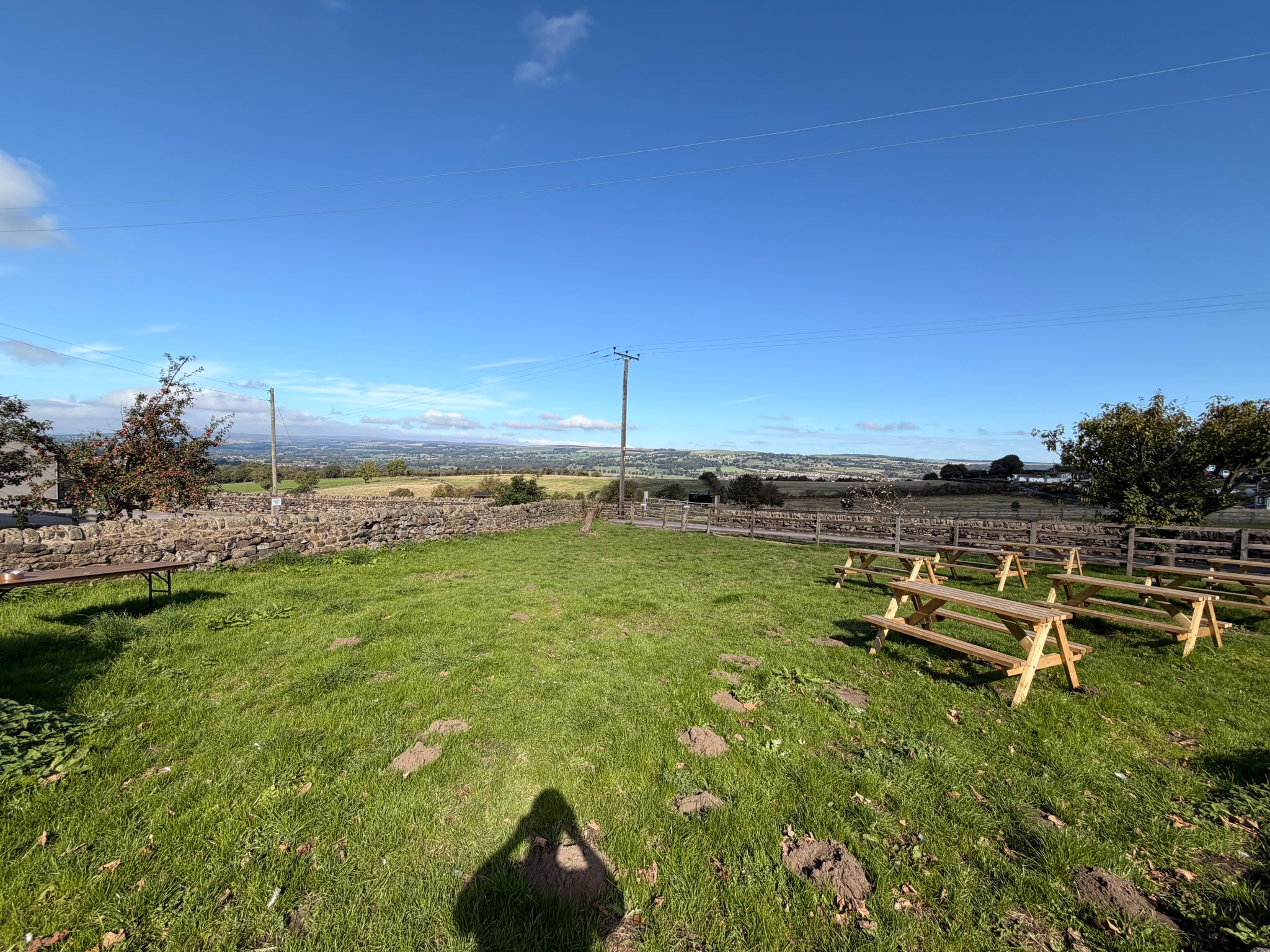 Beer garden with picnic tables and valley views