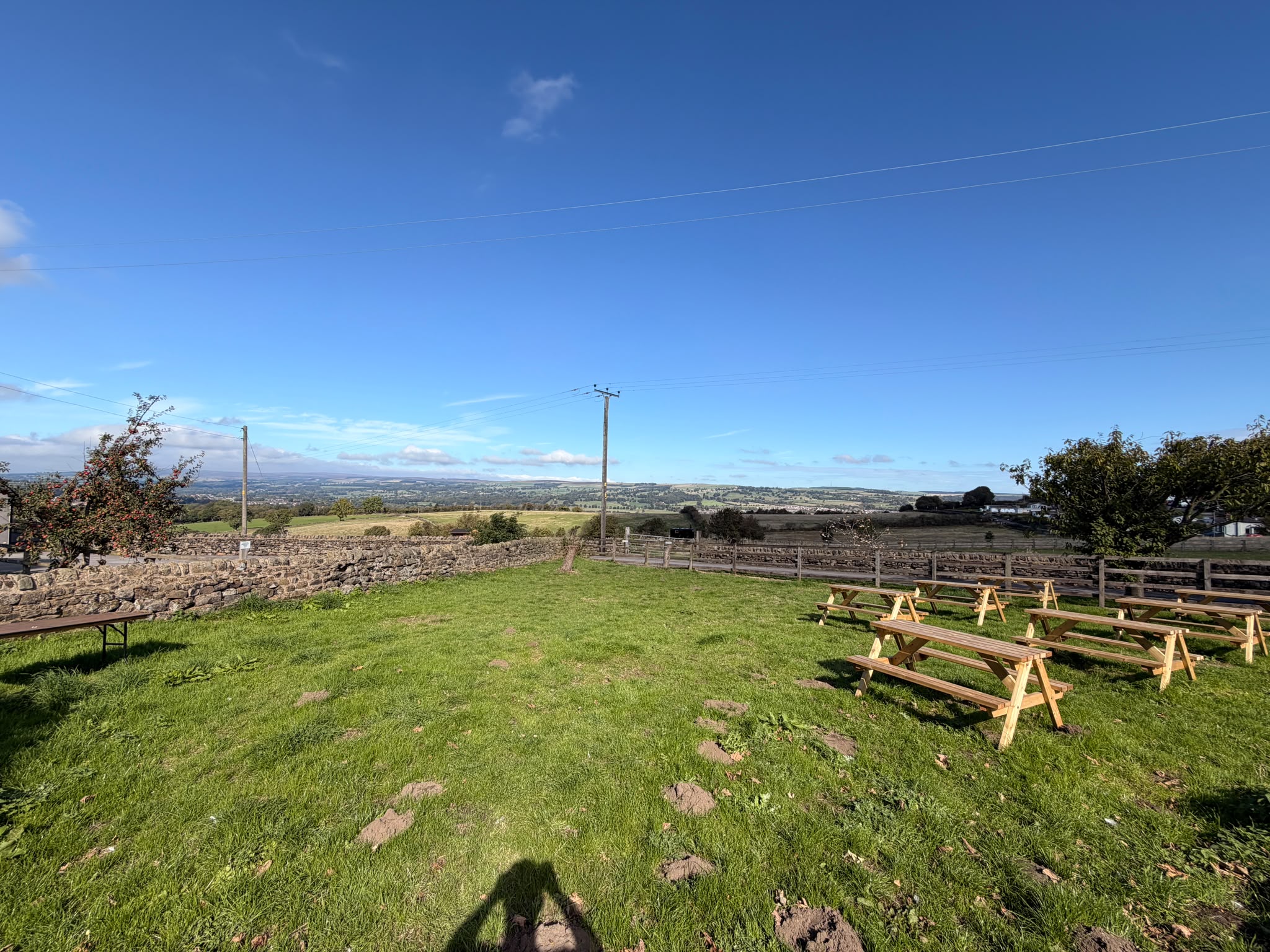 Grassy beer garden under blue skies